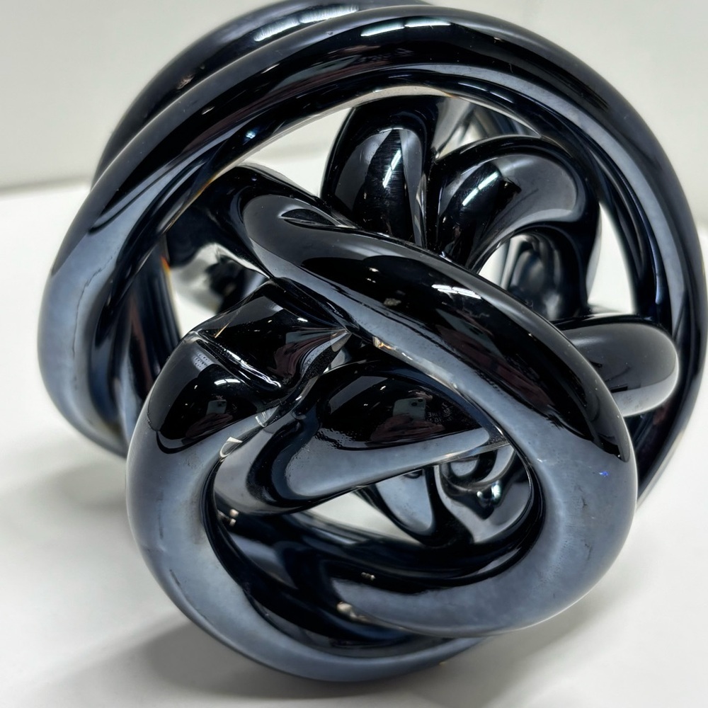 Beautiful dark chrome glass art infinity knot